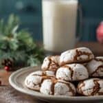 Gingerbread crinkle cookies arranged with candy canes and pine branches