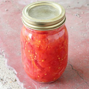 Easy recipe for canning diced tomatoes in a water bath. One of my favorite recipes for canning tomatoes!
