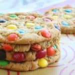 The BEST giant soft M&M cookie recipe. A secret ingredient makes them turn out perfect every time. My favorite giant cookie recipe!
