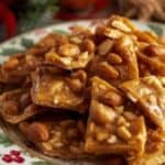 Microwave peanut brittle served in a festive bowl with holiday decorations