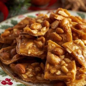 Microwave peanut brittle served in a festive bowl with holiday decorations