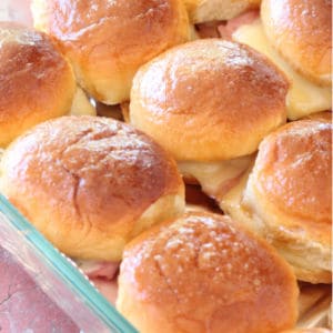 Easy recipe for ham and swiss sliders. My favorite sliders recipe made with hawaiian sweet rolls!