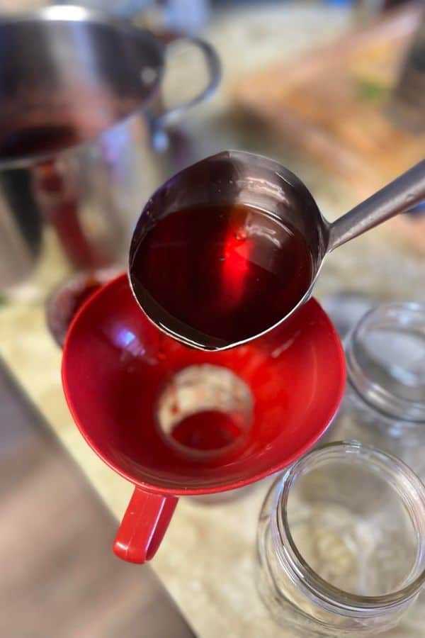 Step by step instructions for canning strawberry jelly.