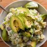 Close-up of avocado potato salad with celery and lemon dressing
