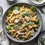 Healthy chicken Caesar pasta salad with grilled chicken and Caesar dressing
