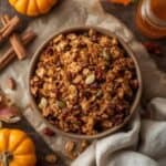 crunchy pumpkin granola with oats, nuts, and pumpkin seeds in a jar