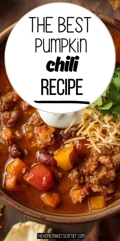 Bowl of hearty pumpkin chili with beans, topped with sour cream and fresh herbs.